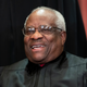 In this Nov. 30, 2018 photo, Supreme Court Associate Justice Clarence Thomas sits for a group portrait at the Supreme Court Building in Washington.